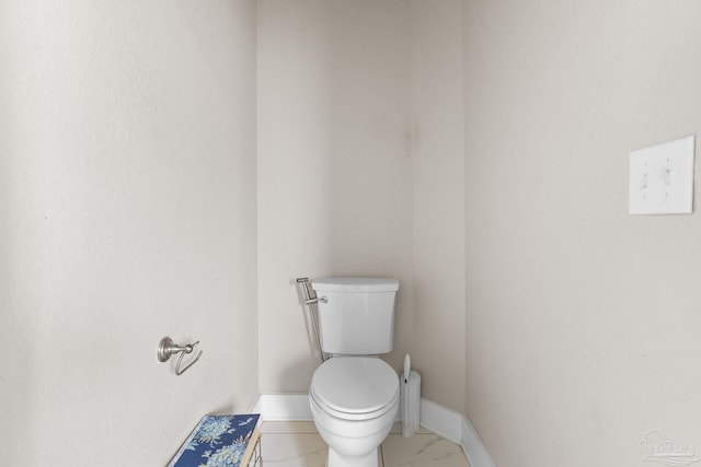 2420 Okatie Ln, Cantonment, FL 32533 - bathroom with marble finish floor, toilet, and baseboards