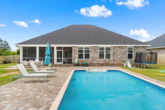 2420 Okatie Ln, Cantonment, FL 32533 - rear view of house with a patio area, a fenced backyard, a fenced in pool, and a sunroom