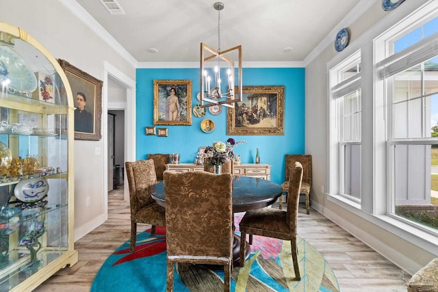 2420 Okatie Ln, Cantonment, FL 32533 - dining room featuring light wood-style floors, visible vents, a wealth of natural light, and a notable chandelier