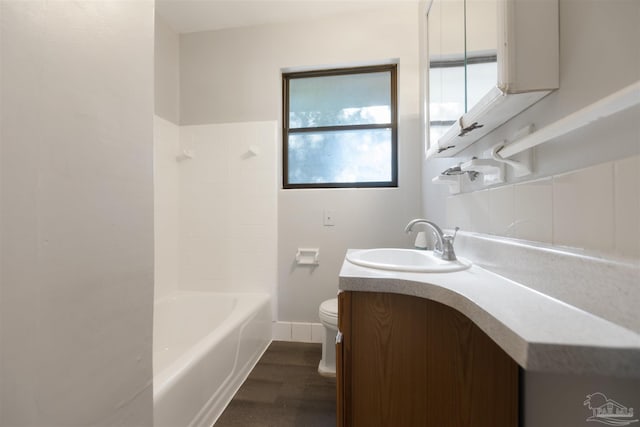 full bathroom with toilet, shower / bathtub combination, hardwood / wood-style floors, and vanity