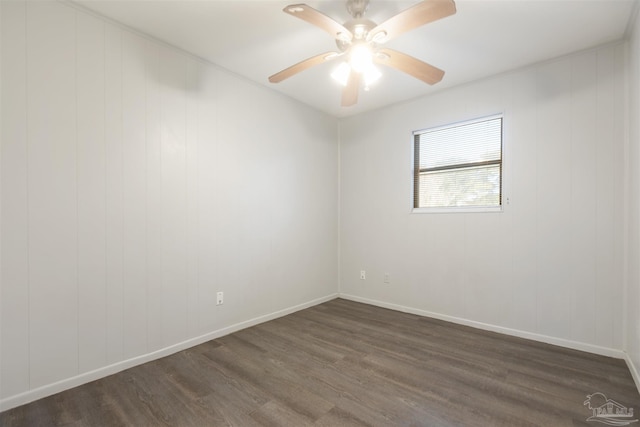 unfurnished room featuring ceiling fan and dark hardwood / wood-style floors