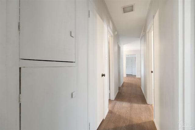 hallway featuring hardwood / wood-style floors