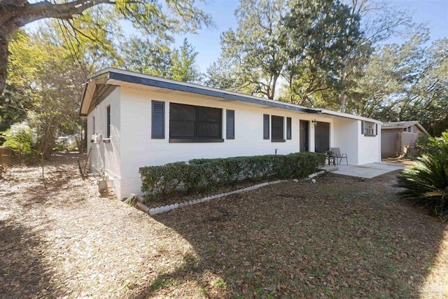 ranch-style house with a patio area