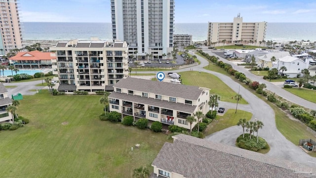 view of urban area with a large body of water and apartment complex