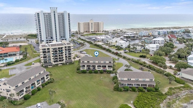aerial view of property and surrounding area featuring a large body of water and apartment complex / building