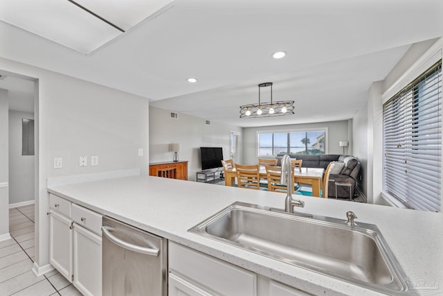 kitchen with open floor plan, dishwasher, light tile patterned flooring, light countertops, and recessed lighting
