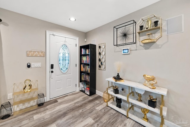 foyer entrance featuring recessed lighting, baseboards, and wood finished floors