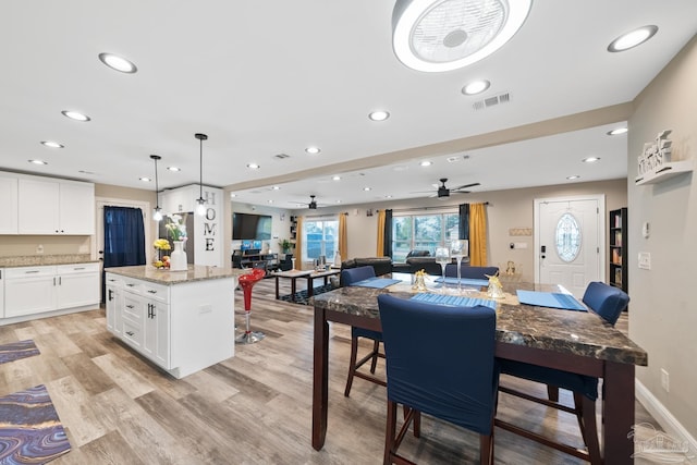 dining space featuring baseboards, visible vents, recessed lighting, ceiling fan, and light wood-type flooring