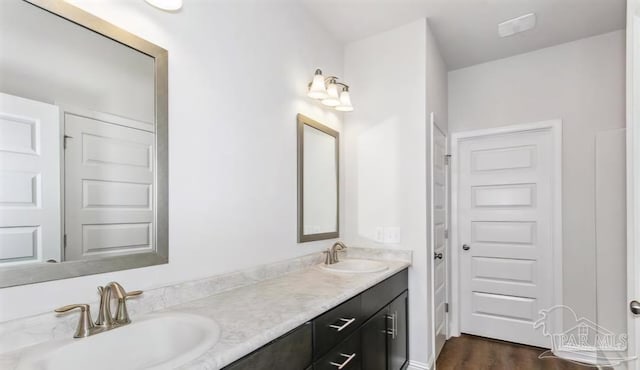 bathroom with vanity and hardwood / wood-style flooring