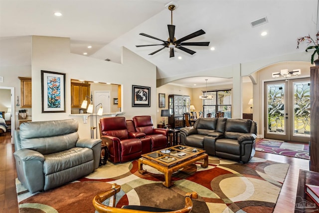 living room with ceiling fan, light hardwood / wood-style flooring, high vaulted ceiling, and french doors