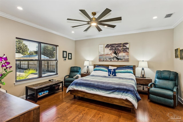 bedroom with ceiling fan, dark hardwood / wood-style floors, and ornamental molding