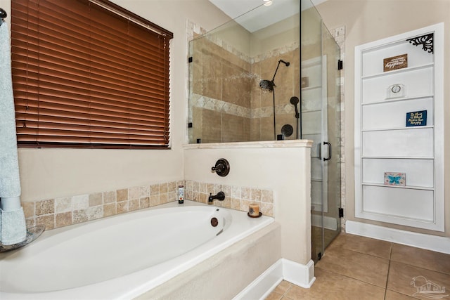 bathroom featuring tile patterned flooring and plus walk in shower