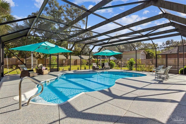 view of pool featuring a storage unit, a lanai, and a patio