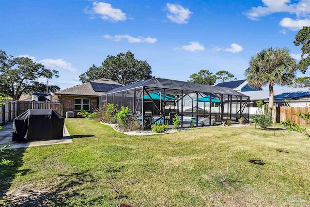 view of yard featuring a lanai and a fenced in pool