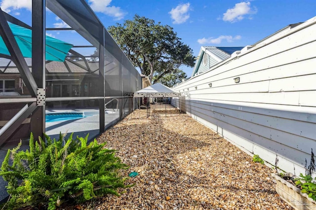 view of yard with a patio and a lanai