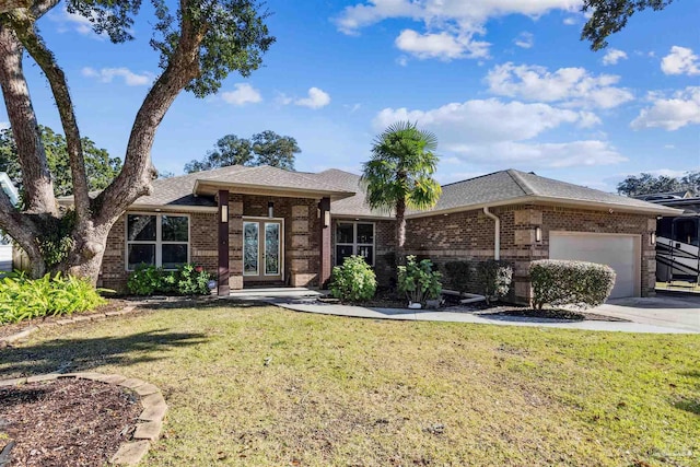 view of front of home featuring a garage and a front lawn