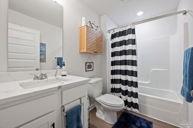 full bath featuring shower / tub combo, vanity, toilet, and wood finished floors