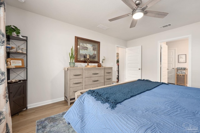 bedroom with visible vents, ceiling fan, light wood-style flooring, and baseboards