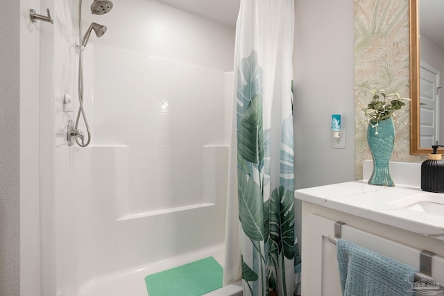 full bathroom with a shower with curtain and vanity