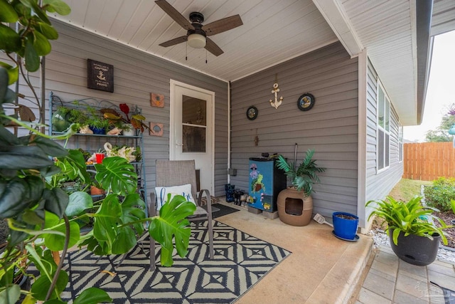 view of patio / terrace featuring fence and a ceiling fan