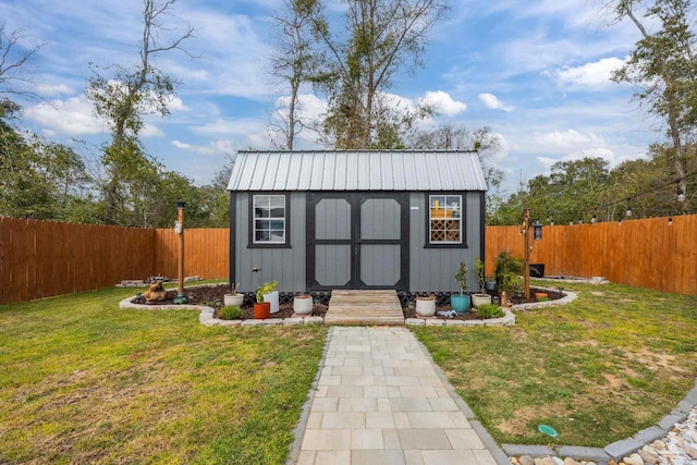 view of shed featuring a fenced backyard