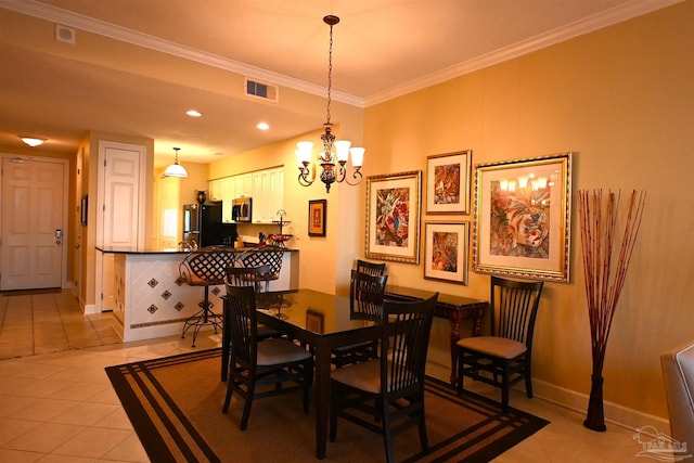 tiled dining space featuring crown molding and a chandelier