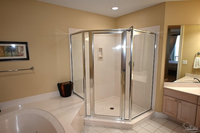 bathroom featuring vanity, tile patterned floors, and independent shower and bath