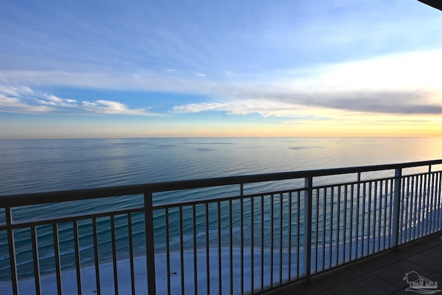 balcony at dusk with a water view