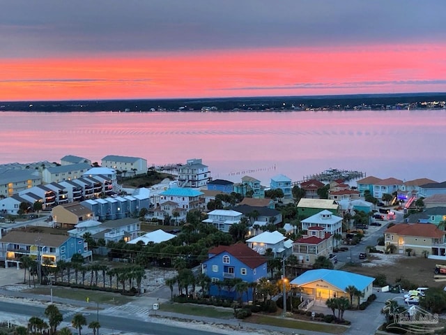 aerial view at dusk with a water view