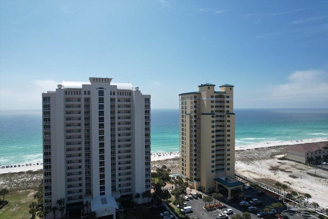 exterior space featuring a view of the beach and a water view