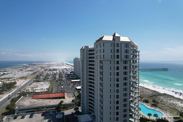 bird's eye view featuring a water view and a view of the beach