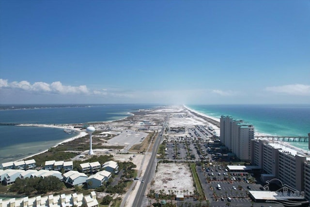 bird's eye view featuring a view of the beach and a water view