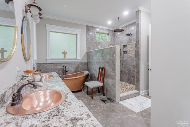 bathroom featuring tile patterned flooring, plus walk in shower, double sink, and ornamental molding