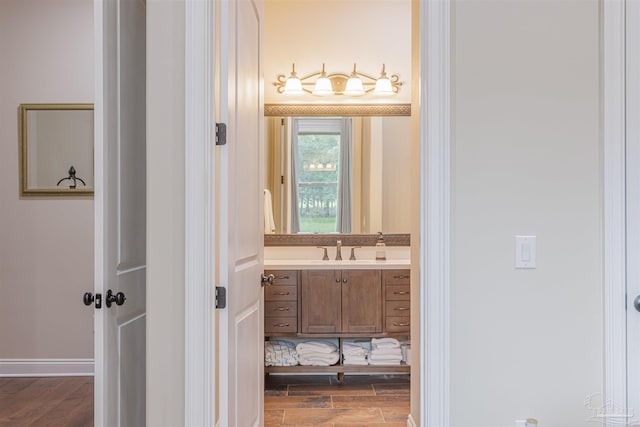 bathroom with vanity and wood-type flooring