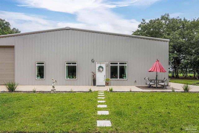 9180 Chumuckla Hwy, Pace, FL 32571 - rear view of property with a lawn and a patio area