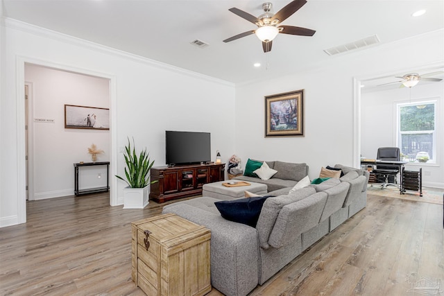9180 Chumuckla Hwy, Pace, FL 32571 - living area featuring light wood-type flooring, visible vents, crown molding, and ceiling fan