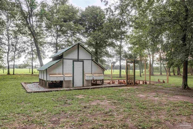 view of outdoor structure with a lawn