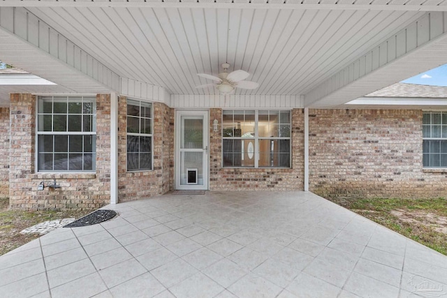 view of patio featuring ceiling fan