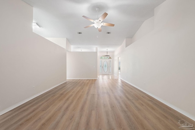 unfurnished living room with hardwood / wood-style floors and ceiling fan