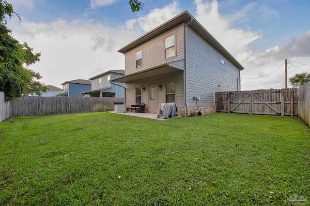 2275 Janet St, Navarre, FL 32566 - back of house featuring a patio and a fenced backyard