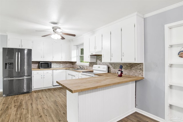 6790 Data St, Pensacola, FL 32504 - kitchen with stainless steel appliances, ceiling fan, decorative backsplash, butcher block countertops, and crown molding