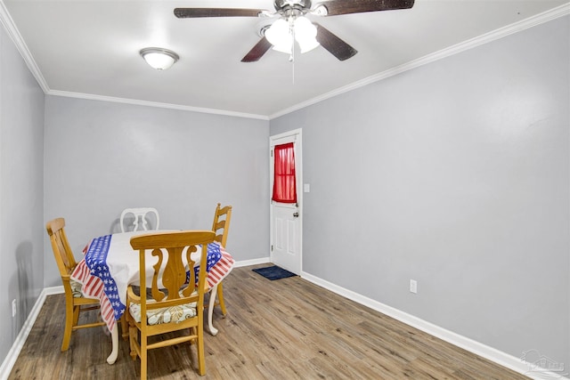6790 Data St, Pensacola, FL 32504 - dining space with crown molding, wood finished floors, and ceiling fan
