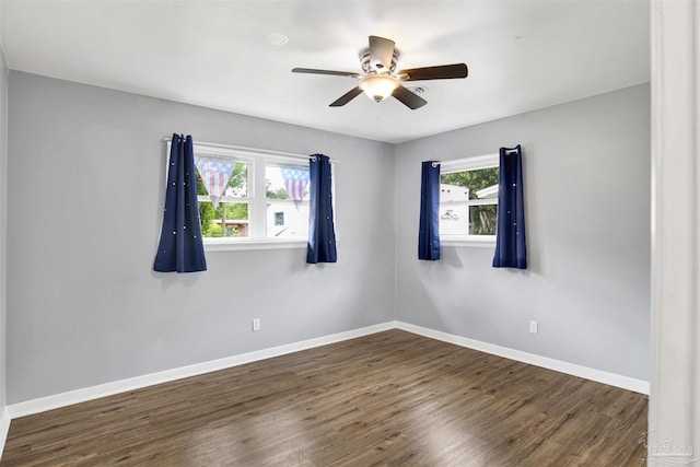 6790 Data St, Pensacola, FL 32504 - unfurnished room with healthy amount of natural light, a ceiling fan, and wood finished floors