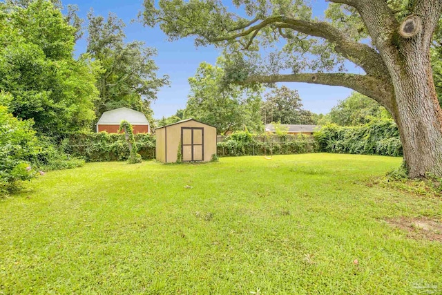 6790 Data St, Pensacola, FL 32504 - view of green lawn with a storage shed