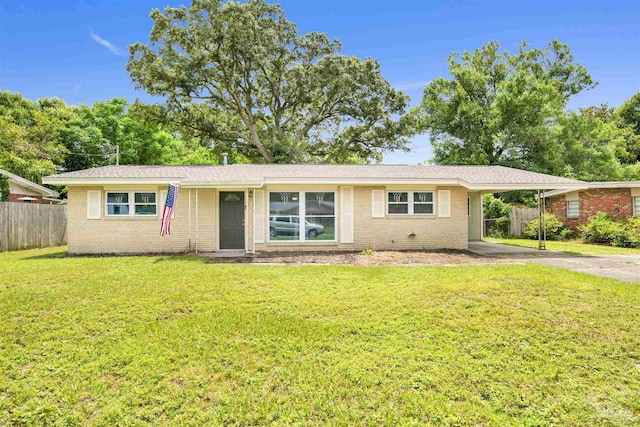 6790 Data St, Pensacola, FL 32504 - ranch-style house featuring asphalt driveway, brick siding, and an attached carport
