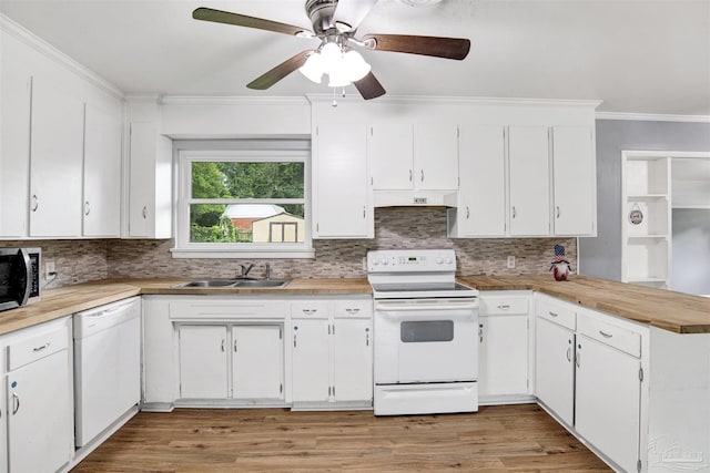 6790 Data St, Pensacola, FL 32504 - kitchen featuring white appliances, ornamental molding, a peninsula, white cabinets, and backsplash