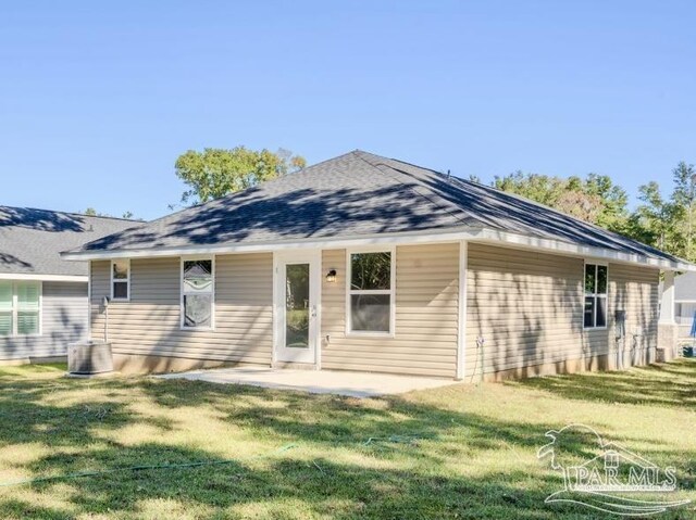 back of house featuring a yard and a patio