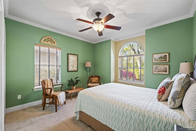 bedroom featuring crown molding, baseboards, carpet floors, and a textured ceiling