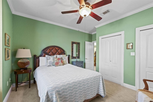 bedroom featuring visible vents, baseboards, carpet, and ornamental molding