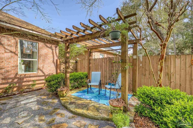 view of patio featuring fence and a pergola